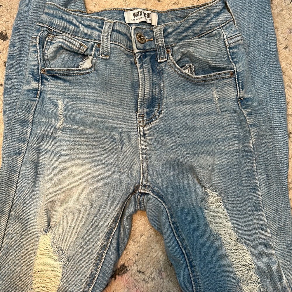 Light blue jeans with rips size 0/24